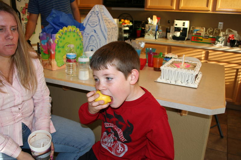 Mike eating a lemon